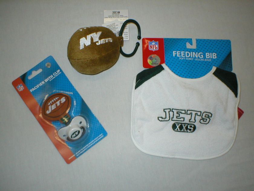   nipple), a bib, and a football shaped rattle. All items are new